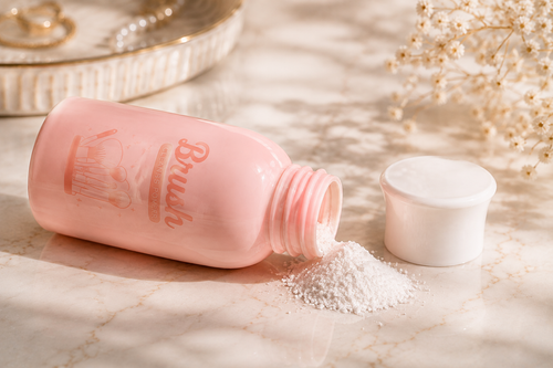 Velveet Brush Cleansing Powder pouring out of the bottle